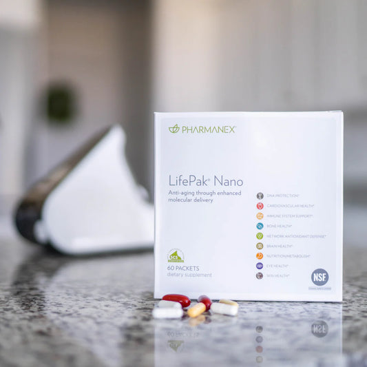 LifePak Nano dietary supplement box on kitchen counter with daily capsules in front, promoting anti-aging and overall health benefits.